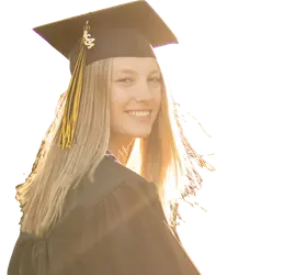 Smiling graduate in cap and gown