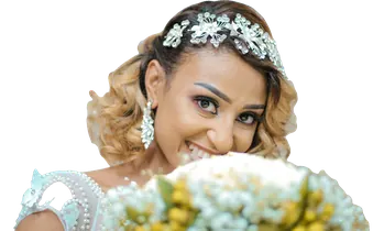 Smiling bride holding white flowers