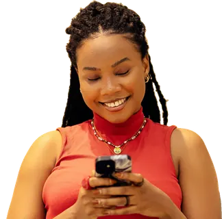 Woman on a sofa smiling at her phone
