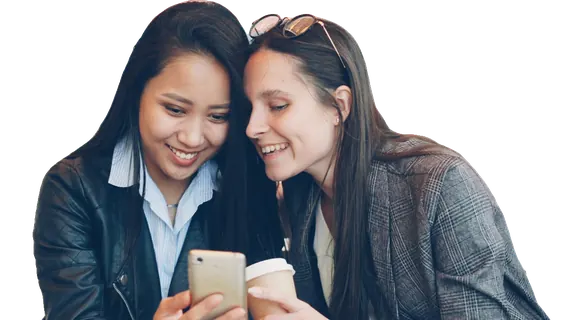 Two friends looking at one phone together